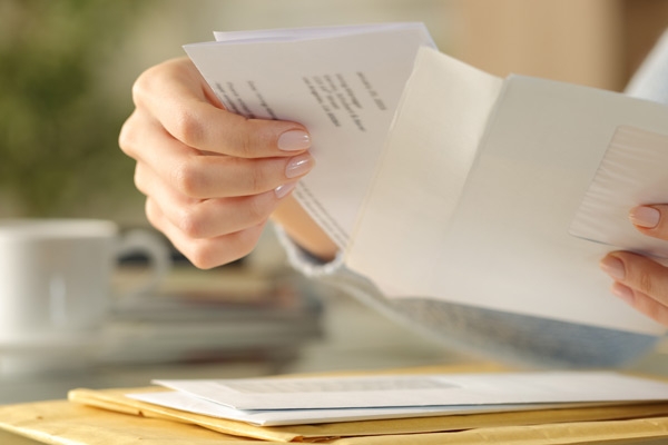 hands with envelope